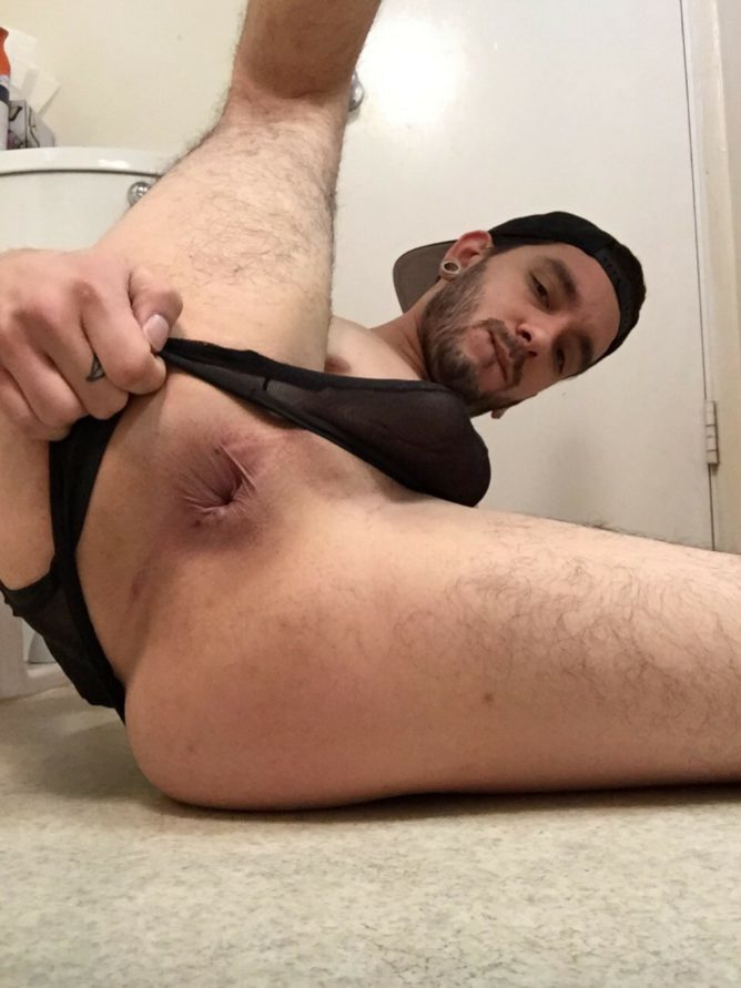 Shaving his ass